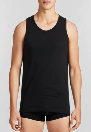 Top in cotone nero, caratterizzato da un colletto rotondo e spalline larghe, design aderente e texture liscia. Stile minimalista, senza fantasie.