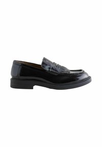 Black patent leather loafer with a flat sole, curved design, and decorative fringe detail on the front. Smooth, shiny texture throughout.