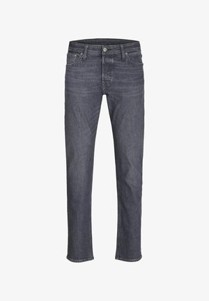 Tummansiniset farkut suoranlahkeisella muotoilulla, jossa on klassinen viiden taskun tyyli, vyölenkit ja hillitty hapsutustyö.