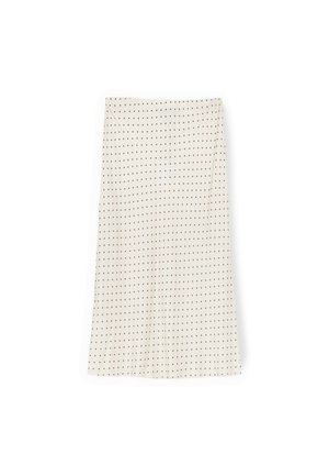 Falda midi color crema con lunares negros, corte recto y una sutil abertura en el lateral.