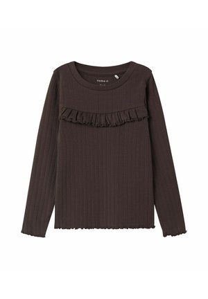 Brązowy długi rękaw top z przyjemną strukturą, z falbaniastym akcentem na klatce piersiowej i falbaniastymi brzegami. Wykonany z miękkiego materiału.