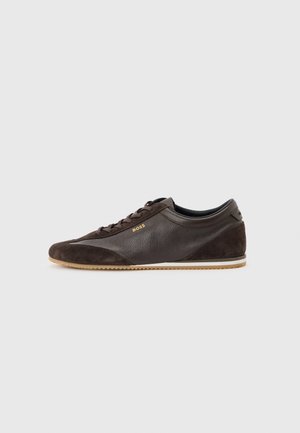 Dark brown low-top leather sneaker with suede accents, lace-up design, light brown rubber sole, and small gold "BOSS" logo on the side.