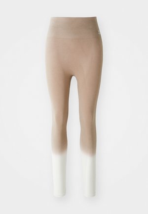 Beige to white ombre seamless leggings with high waistband, displayed against a plain white background.