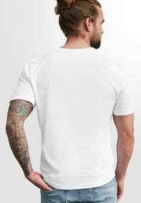 White short-sleeve t-shirt made of cotton, featuring a crew neckline and a relaxed fit. Visible tattoo designs on the arm.
