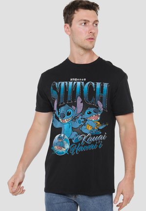 Black cotton t-shirt featuring a colorful Stitch character graphic, with blue and pink accents. Text reads "Kauai Hawai'i" beneath the design.