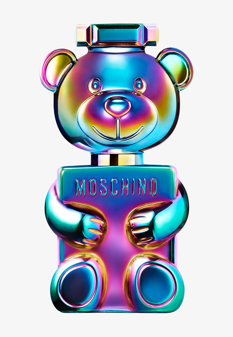 Iridescent metallic teddy bear-shaped perfume bottle holding a rectangular plaque with "MOSCHINO" embossed.