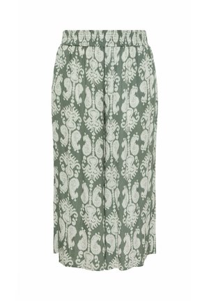 Grønne bukser med vide ben, hvide abstrakte blomsterprint og elastisk taljebånd, vist fladt på en hvid baggrund.