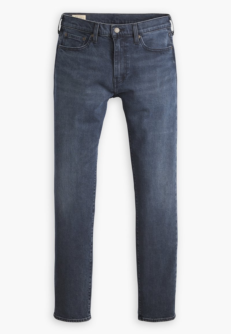 Jean slim bleu foncé avec poches avant et arrière, fermeture à bouton et passants de ceinture.
