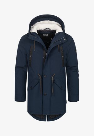 Marineblå parkajakke med hette, med fuskepelsfôr, to framlommer og svart detaljer på skuldrene og glidelåsen.