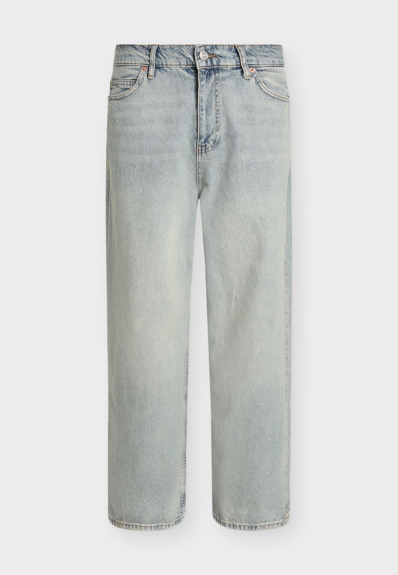 Ljusblåa jeans i denim med avslappnad passform, raka ben och en lätt blekt finish. Har fem fickor och sydda detaljer.
