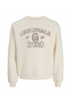 Felpa color crema con testo ricamato marrone che dice "ORIGINALS 1990 STUDIO" e un logo circolare al centro.