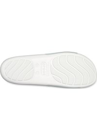 White rubber shoe sole with textured grip pattern, featuring curved lines and a logo. Smooth finish with a lightweight design.