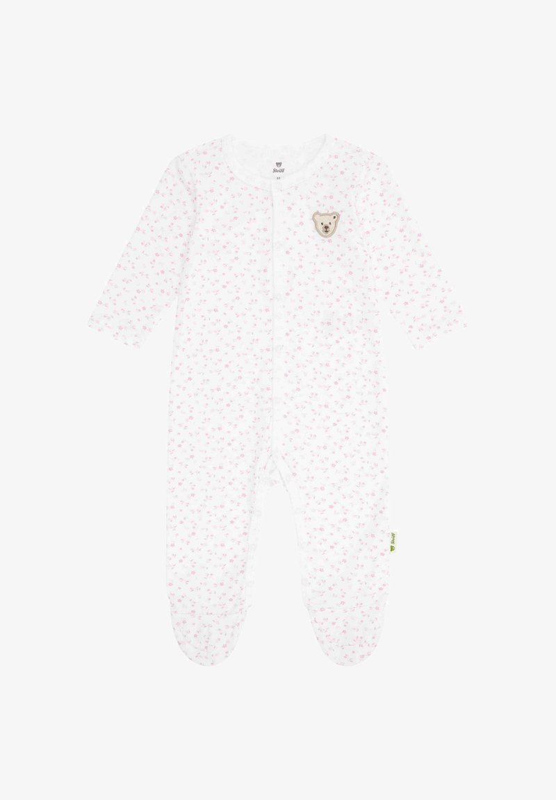Body bébé blanc à manches longues, avec un motif floral rose et un patch ours sur la poitrine. Comprend des fermetures à pression et des jambes avec pieds.