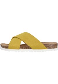 Infradito gialli con cinturini incrociati in suede, sole in sughero e suola in gomma bianca. Design piatto, stile casual con tomaia testurizzata.