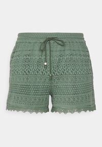 Gröna virkade spetsshorts med dragsnöre i midjan och scallopdetaljer, designade för vardagsbruk.