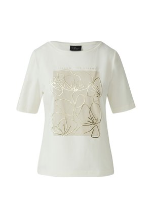 Cremefarbendes Baumwoll-T-Shirt mit kurzen Ärmeln, das ein goldbedrucktes florales Design und den Text "FOLLOW YOUR DREAMS" in einem rechteckigen Rahmen zeigt.