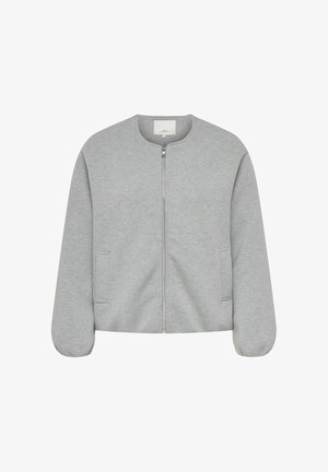 Helehall zipiga jope ümmarguse kaelusega, pikkade varrukatega, millel on elastsed mansetid, ning kahe küljetaskuga, valgel taustal.