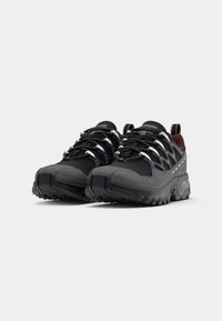 Black outdoor shoes with a textured finish, rubber sole, and reflective accents. Features elastic laces and padded collar for comfort.