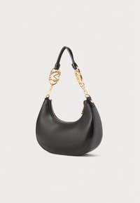 Black leather handbag with a smooth texture; crescent shape; features a gold chain with unique accents and a top zipper closure.
