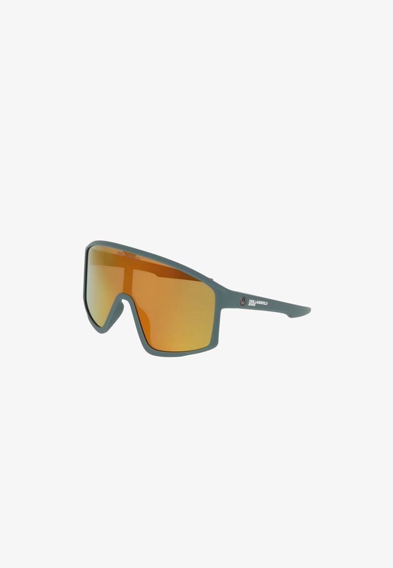 Lunettes de soleil sportives enveloppantes avec monture grise et verres orange miroitants, arborant le logo Karl Lagerfeld Jeans sur la branche.