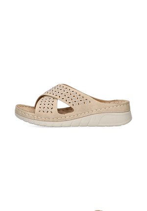 Las sandalias de slide color beige presentan una parte superior perforada con elementos decorativos, una suela acolchada para mayor comodidad y un diseño casual adecuado para climas cálidos.