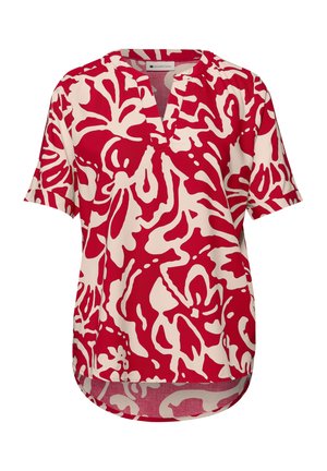 Lyhythihainen punavalkoinen abstrakti kuvioitu pusero, jossa on V-kaula-aukko ja rento istuvuus, etureuna hieman takaa lyhyempi.