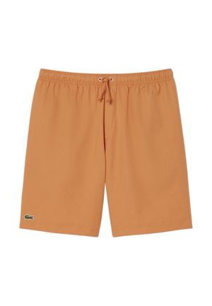 Bañador corto naranja con cintura elástica, cordón ajustable y logo de Lacoste en la pierna izquierda. Tela suave y ligera.