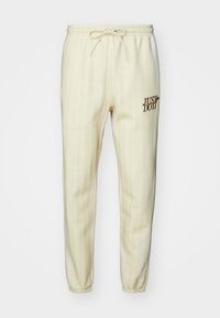 CLUB - Trainingsbroek - light khaki/british tan