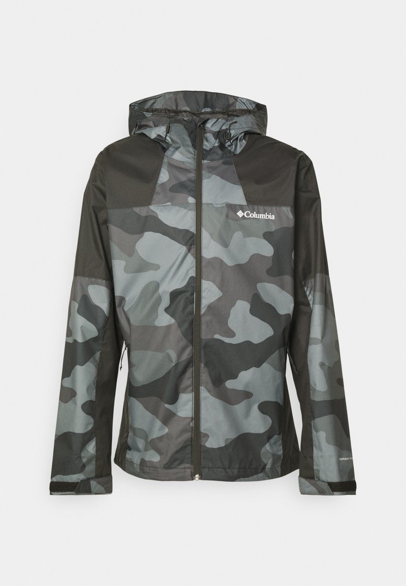 Chaqueta de camuflaje en tonos de gris y negro, con cierre de cremallera en el frente, capucha y el logo de Columbia en el pecho. Material ligero y resistente al agua.