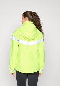 Yellow waterproof jacket with reflective silver stripe, hood, and elastic cuffs. Lightweight fabric with a smooth texture. Back view shows design.