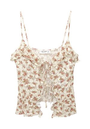 Bloemrijke camisole met dunne bandjes, voorzien van een kanten overlay, gerimpelde randen en een gestrikt voorpand. Kleuren zijn onder andere crème met roze en groene accenten.