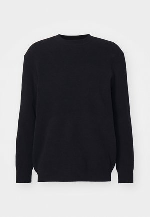 Maglione nero a coste con maniche lunghe e scollo tondo. Realizzato in morbido tessuto lavorato a maglia, presenta una vestibilità comoda e senza dettagli hardware visibili.