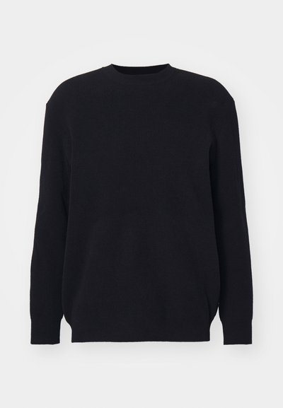 Zwart geribbeld sweater met lange mouwen en een ronde halslijn. Gemaakt van zacht gebreid stof, met een relaxte pasvorm en zonder zichtbare hardware-details.