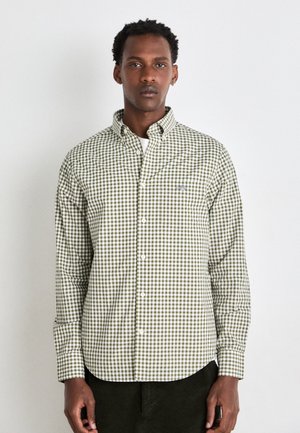 Grün-weiß kariertes Hemd mit Knöpfen und Kragen. Slim-Fit und lange Ärmel, mit einem kleinen Logopatch auf der linken Brust.