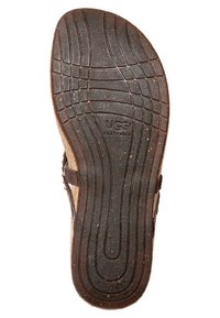 Sole di sandalo in gomma marrone con superficie testurizzata, motivi in rilievo e un logo. Dotata di una soletta sagomata e scanalature flessibili per il comfort.