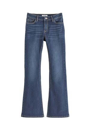 Jeans en denim évasés de couleur bleu foncé avec une texture lisse, dotés de cinq poches et de coutures contrastantes jaunes le long des coutures.