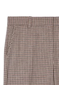 Wełniane spodnie z brązowym i kremowym wzorem w zębatkę, z bocznymi kieszeniami i płaskim pasem. Teksturowana tkanina.