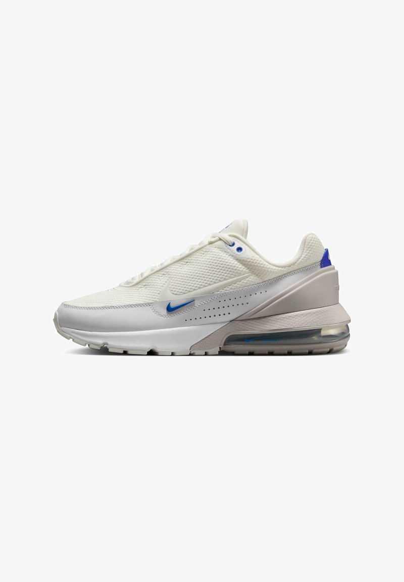 White athletic sneaker with a textured upper, blue accents, visible air cushioning in the sole, and a smooth, durable outsole.