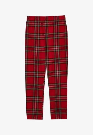 Red plaid pants featuring an elastic waistband, with horizontal and vertical stripes in white, green, and black throughout the fabric.