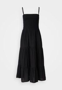 Robe midi noire avec corsage smocké et fines bretelles. Dotée d'une jupe à volants avec une texture fluide. Design simple et classique.