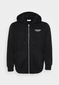 Zwarte zip-up hoodie gemaakt van een katoenmix, met een voor zakken voor de handen, een capuchon met trekkoord en een wit logo op de borst.