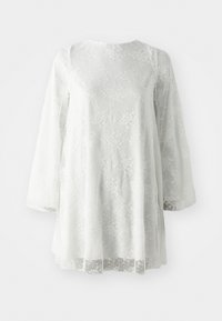 Tunic alb din dantelă cu mâneci lungi, având un model texturat și un guler rotund. Material ușor și semi-transparent.