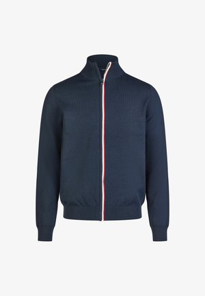 Navy Zip-Jacke mit hohem Kragen, ausgestattet mit einem zentralen Reißverschluss und kontrastierenden roten und weißen Streifen entlang der Vorderseite. Strukturiertes Strickmaterial.