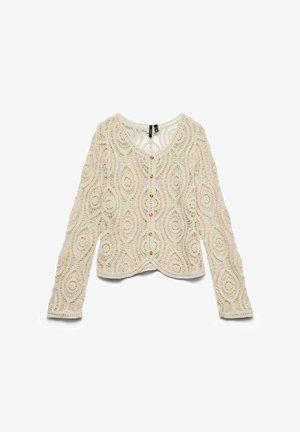 Cardigan à manches longues en crochet de couleur crème avec des motifs circulaires et ovales, boutonnière sur le devant et encolure arrondie.