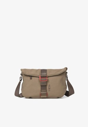 Beige messenger bag with a fold-over flap, brown strap, red buckle accent, and logo. Made of durable fabric, featuring a smooth texture.