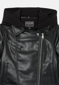 Black faux leather jacket with a zip closure, pointed collar, and attached black fabric hoodie. Features a side pocket and subtle stitching details.