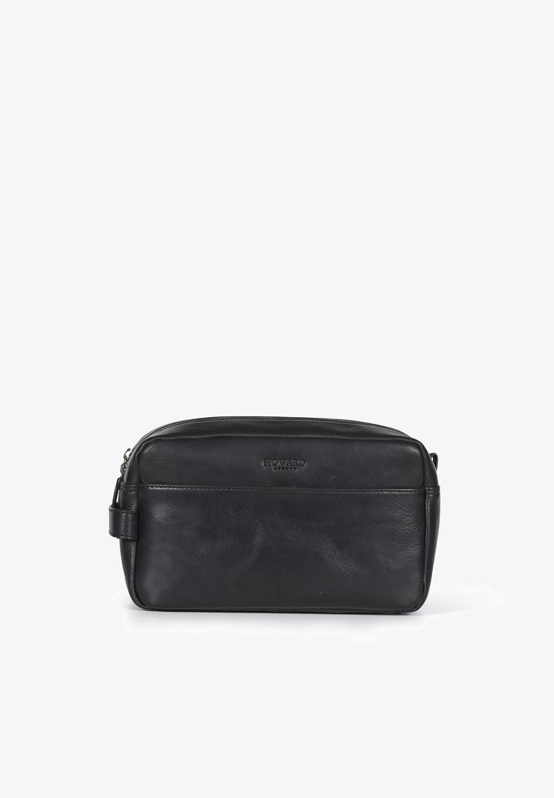 Svart kosmetikkveske i lær med glidelås, flat rektangulær form og subtil teksturert overflate. Har en sidehåndtak for enkel bæring.