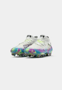 Soccer cleats featuring a white upper with a colorful tie-dye pattern in blue, pink, and green. Includes a sock-like collar and studs.