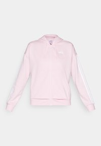 Světle růžová mikina na zip s kapucí na stažení, bílé ozdobné pruhy na rukávech a přední kapsy. Na hrudi se nachází logo Adidas.