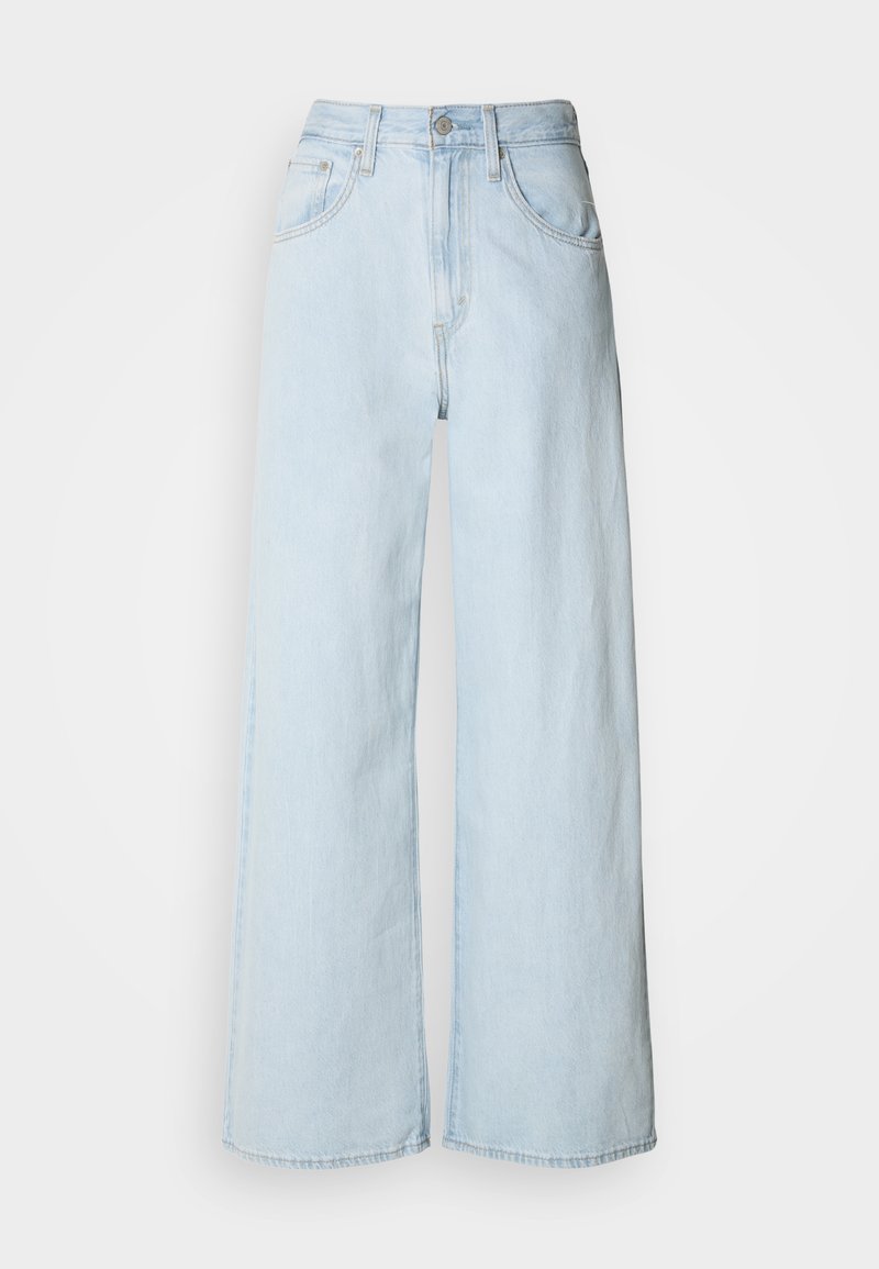Lyseblå vidde bukser i denim med høj talje, forlommer og en ren kant. Minimale syningsdetaljer.
